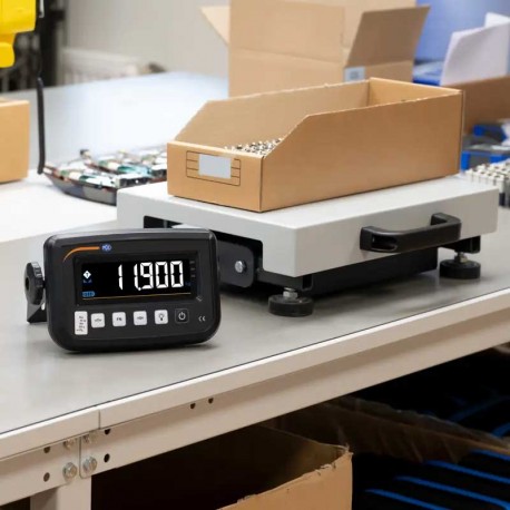 Balanza pesadora con peso